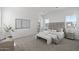 Beautifully staged Primary bedroom with neutral color palette and luxurious furnishings at 2149 W Rowel Rd, Phoenix, AZ 85085