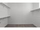 Bright and spacious walk-in closet featuring ample shelving and neutral carpet at 2149 W Rowel Rd, Phoenix, AZ 85085
