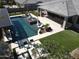 Aerial view of a modern home with a resort-style pool, spa, outdoor kitchen, and manicured backyard at 22867 E Via Las Brisas --, Queen Creek, AZ 85142