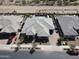 Aerial view of a modern home with desert landscaping and a private driveway, showcasing its street presence at 22867 E Via Las Brisas --, Queen Creek, AZ 85142