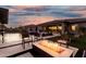 Stunning backyard with a fire pit, pool, and covered patio for outdoor entertaining at 22867 E Via Las Brisas --, Queen Creek, AZ 85142