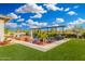 Backyard featuring a beautiful pool with a pergola and lush landscaping under a bright sky at 22867 E Via Las Brisas --, Queen Creek, AZ 85142