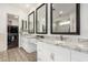Bright bathroom with dual sinks, granite countertops, and a walk-in closet at 22867 E Via Las Brisas --, Queen Creek, AZ 85142