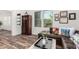 Cozy living room with stylish furniture, wood-look floors, and natural lighting at 22867 E Via Las Brisas --, Queen Creek, AZ 85142