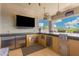 This gorgeous outdoor kitchen features stainless steel appliances, a sink, and a bar at 22867 E Via Las Brisas --, Queen Creek, AZ 85142