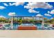 Resort-style pool and spa featuring lounge chairs, umbrellas and a pergola with lush landscaping at 22867 E Via Las Brisas --, Queen Creek, AZ 85142