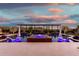 Evening shot of a resort-style pool and spa featuring lounge chairs, umbrellas and a pergola with lush landscaping at 22867 E Via Las Brisas --, Queen Creek, AZ 85142