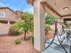 Relaxing backyard features a covered patio with a swing and low-maintenance landscaping at 2307 E Pecan Rd, Phoenix, AZ 85040