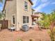The backyard shows neutral siding, a patio cover, and low-maintenance rock landscaping at 2307 E Pecan Rd, Phoenix, AZ 85040