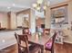 Bright dining area showcases a chandelier, wood table, and an adjacent living space at 2307 E Pecan Rd, Phoenix, AZ 85040