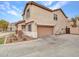 Spacious home with a two-car garage, complemented by a well-maintained yard and inviting front porch at 2307 E Pecan Rd, Phoenix, AZ 85040