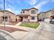 Inviting two-story home featuring a cozy front porch, landscaped yard, and convenient driveway access at 2307 E Pecan Rd, Phoenix, AZ 85040