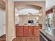 Modern kitchen featuring wood cabinetry, granite counters, and an open view to the living area at 2307 E Pecan Rd, Phoenix, AZ 85040