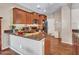 Spacious kitchen boasts granite countertops, wooden cabinets, and modern stainless steel appliances at 2307 E Pecan Rd, Phoenix, AZ 85040