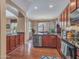 Open-concept kitchen and dining area with granite countertops and plenty of cabinet space at 2307 E Pecan Rd, Phoenix, AZ 85040
