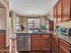 Charming kitchen showcases granite countertops, stainless appliances, and an eat-in bar area at 2307 E Pecan Rd, Phoenix, AZ 85040