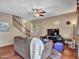 Relaxing living room with a comfortable sofa, hardwood floors, and access to staircase to upper level at 2307 E Pecan Rd, Phoenix, AZ 85040