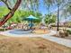 Community playground with slides, play structure, and cushioned ground for safety at 2307 E Pecan Rd, Phoenix, AZ 85040