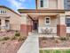 Charming front porch with seating area, decorative brick accents, and a welcoming entrance to the home at 2307 E Pecan Rd, Phoenix, AZ 85040
