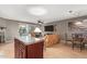 Open-concept living room and dining area with fireplace and plenty of natural light at 2315 W Union Hills Dr # 124, Phoenix, AZ 85027
