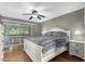 Comfortable main bedroom features a ceiling fan, private patio entrance, and neutral tones at 2315 W Union Hills Dr # 124, Phoenix, AZ 85027