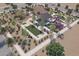 Aerial view of community park featuring a playground, picnic pavilion, bocce ball court, and landscaping at 25727 N 147Th Dr, Surprise, AZ 85387