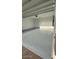Spacious two-car garage featuring painted walls and epoxy-coated flooring for a clean and modern look at 25727 N 147Th Dr, Surprise, AZ 85387