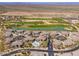 Scenic aerial view of community showcasing the golf course, lake, and lush landscaping at 33550 N Dove Lakes Dr # 1041, Cave Creek, AZ 85331