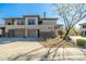 Inviting two-story condo with stucco siding, stone accents, two-car garage and desert landscaping at 33550 N Dove Lakes Dr # 1041, Cave Creek, AZ 85331
