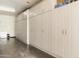 Garage with white cabinets spanning one wall of the garage for storage at 33550 N Dove Lakes Dr # 1041, Cave Creek, AZ 85331