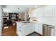Open kitchen with tile countertops, stainless steel appliances and views into the living room at 33550 N Dove Lakes Dr # 1041, Cave Creek, AZ 85331