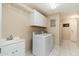 Well-equipped laundry room with sink, storage, washer and dryer at 33550 N Dove Lakes Dr # 1041, Cave Creek, AZ 85331