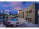 Backyard oasis with a pool, fire pit, and outdoor seating, ideal for relaxing and entertaining under the sky at 33601 N 64Th St, Scottsdale, AZ 85266