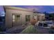 Back of the home showcasing outdoor living space with desert landscaping and a tranquil pool and patio area at 33601 N 64Th St, Scottsdale, AZ 85266