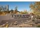 Entrance sign for Terravita Golf and Country Club, surrounded by desert landscaping and natural beauty at 33601 N 64Th St, Scottsdale, AZ 85266