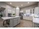 Well-equipped kitchen with an island, stainless steel appliances, and white cabinetry at 33601 N 64Th St, Scottsdale, AZ 85266
