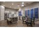 Open concept kitchen with stainless steel appliances, large island with stools, and adjacent dining area at 33601 N 64Th St, Scottsdale, AZ 85266