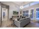 Cozy living room featuring a modern fireplace, a comfortable sofa, and stylish decor at 33601 N 64Th St, Scottsdale, AZ 85266