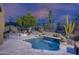 Relaxing pool area with desert landscaping and a fire pit, perfect for outdoor enjoyment at 33601 N 64Th St, Scottsdale, AZ 85266