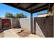 Enclosed backyard patio with concrete block walls and potential landscaping area at 3646 N 69Th Ave # 4, Phoenix, AZ 85033