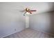 Bedroom features a ceiling fan and tiled flooring at 3646 N 69Th Ave # 4, Phoenix, AZ 85033