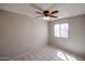 Bedroom has tile flooring and a ceiling fan at 3646 N 69Th Ave # 4, Phoenix, AZ 85033