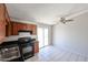 Kitchen featuring updated cabinets, stainless sink, black appliances, and sliding door at 3646 N 69Th Ave # 4, Phoenix, AZ 85033