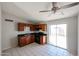 An eat-in kitchen is equipped with appliances and a sliding glass door at 3646 N 69Th Ave # 4, Phoenix, AZ 85033