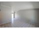 Spacious living room featuring tile flooring, gray walls and ceiling fan at 3646 N 69Th Ave # 4, Phoenix, AZ 85033