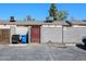 View of a parking area with back entrances featuring security gates at 3646 N 69Th Ave # 4, Phoenix, AZ 85033