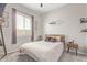 Bedroom with modern gray decor features a ceiling fan, and a 'Game Zone Loading' decal on the wall at 4090 S Virginia Way, Chandler, AZ 85249