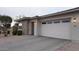 Charming home featuring a paved driveway, a two-car garage, and manicured landscaping at 4090 S Virginia Way, Chandler, AZ 85249