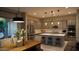 Gourmet kitchen and dining area featuring gray cabinets and stainless steel appliances at 4090 S Virginia Way, Chandler, AZ 85249