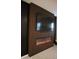 Close-up view of dark accent wall with fireplace in a living room at 4090 S Virginia Way, Chandler, AZ 85249